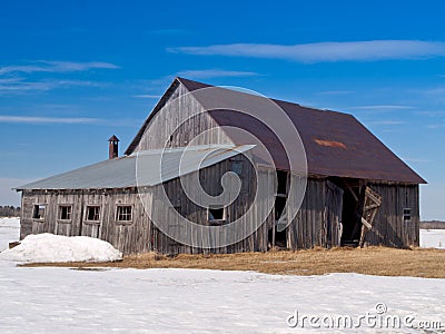 Old abandoned rusted barn Stock Photo
