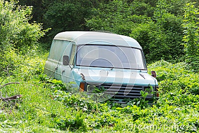 Old, abandoned, rusted and broken van Stock Photo