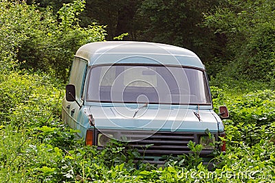 Old, abandoned, rusted and broken van Stock Photo