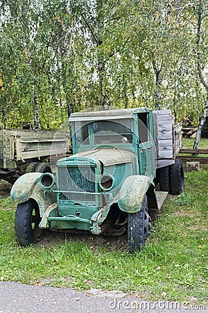 Old abandoned rusted green truck Stock Photo