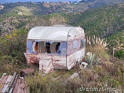 Old abandoned rusted roulotte Rv van Stock Photo