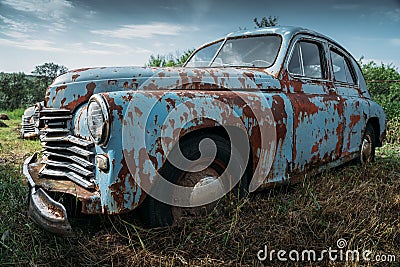 Old abandoned rusty vehicle, forgotten retro car Stock Photo