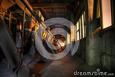 Old abandoned silo elevator with rusty equipment left Stock Photo