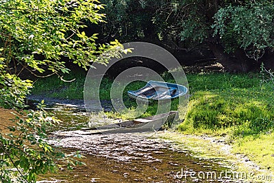 Old abandoned and submerged boat Stock Photo