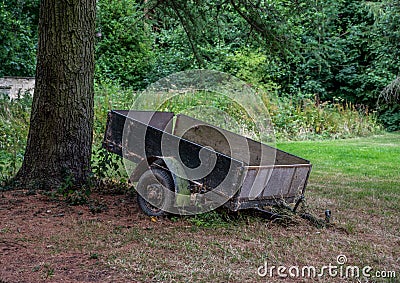 Abandoned Trailer under a tree Stock Photo