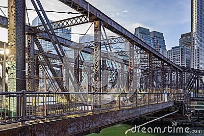 Old abandoned truss bridge in the bay on the modern waterfront in Boston Stock Photo