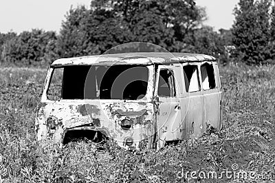 old and abandoned van is standing and rotting for eternity Stock Photo