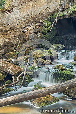 Old, abandoned water mill with water streams and little waterfalls Stock Photo