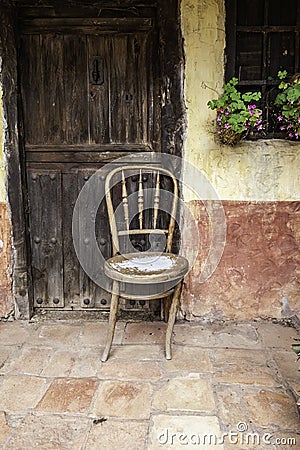 Old abandoned wooden chair Stock Photo