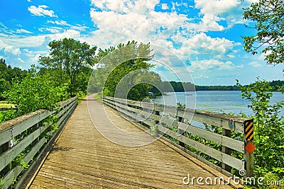 The Old Abe Trail passes over a wooden bridge along the Chippewa River near Jim Falls, WI. Stock Photo