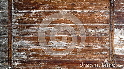Old abstract brown peeled off rustic wooden boards / wooden gate / wooden door texture, with teel bolt - wood background shabby Stock Photo