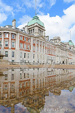 Old Admiralty Building London reflects in a puddle on Horse Guards Parade Editorial Stock Photo