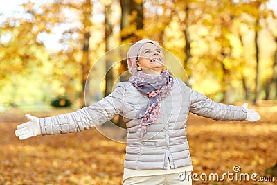 Happy senior woman enjoying beautiful autumn Stock Photo
