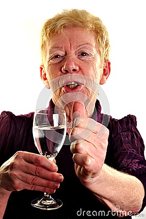 old age woman is holding a glass of water Stock Photo