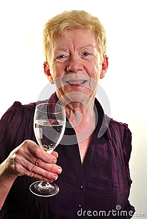 old age woman is holding a glass of water Stock Photo