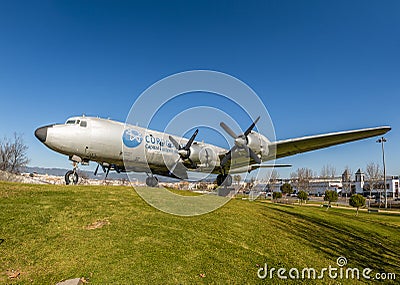 Old airplane on green meadow in sunlight Editorial Stock Photo