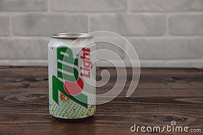 An old aluminium can of 7up soft drink against the brick wall Editorial Stock Photo