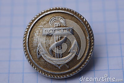 Old aluminum german military button with sea anchor Stock Photo