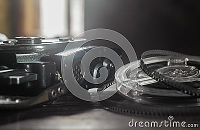 Old amateur movie camera and reels of film stock Stock Photo