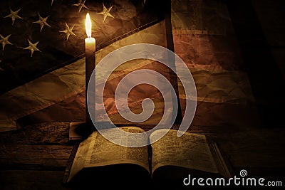 Old american flag and candle. Stock Photo