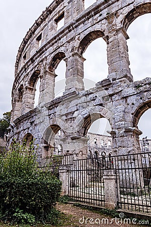 Old amphitheater wall with many arches Stock Photo