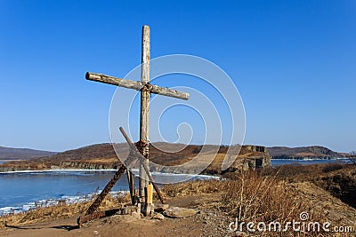 Old anchor fnd cross on a cliff Stock Photo