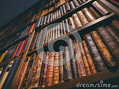 Old ancient Books on Bookshelf History book Library collection Stock Photo