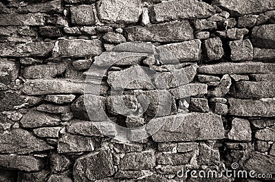 Old ancient Grunge wall stone background textures,black and white rock background. Real stone wall surface, ancient texture. Stock Photo