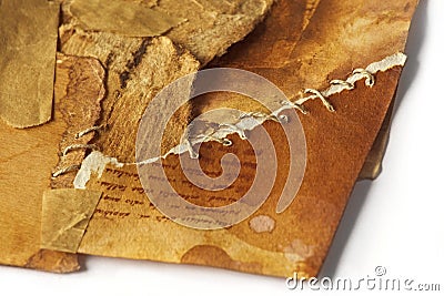 old ancient paper torn in pieces brought back together again, symbolic concept Stock Photo