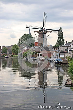 Old ancient windmill along river Old Rhine in city of Bodegraven whch became beer brewery Stock Photo