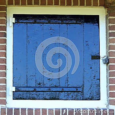 Old ancient window in brick wall Stock Photo