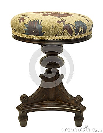 Old antique black stool with a round seat from a piano Stock Photo