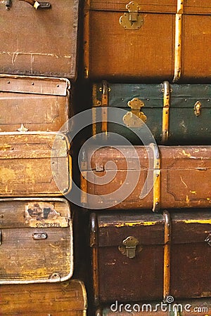 Old antique suitcases, close-up. Vintage retro styled texture. Vertical toned Stock Photo
