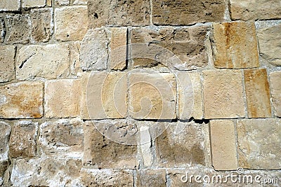 Ancien wall from brown stones front view close up Stock Photo