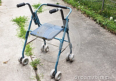 An old antique wheeled walker used for disabilities. Stock Photo