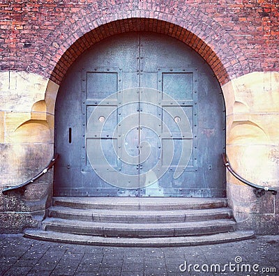 Old arched door and steps Stock Photo