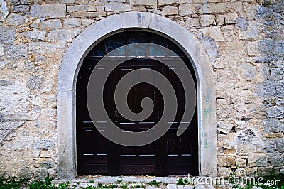 Old Arched wooden doorway Stock Photo