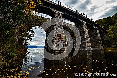 Old archy stone bridge at Transsiberian railway at Baikal lake in autumn Stock Photo