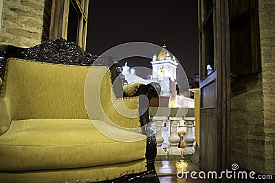 Old armchair located on the balcony of an old hotel Stock Photo