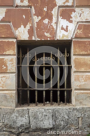 Old arrow type metall grille with rusty paint. Stock Photo