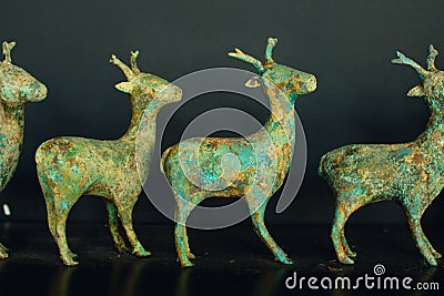 Old Asian statuettes of reindeer Stock Photo