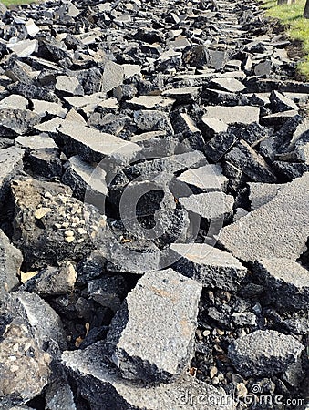 old asphalt, pieces of asphalt, road repairs Stock Photo