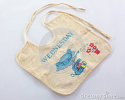 Old baby bib with ties Stock Photo