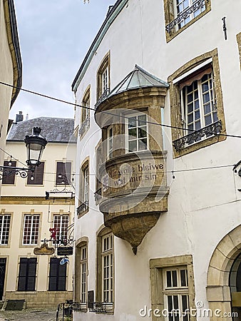 Old balcony with meaningful words, Luxembourg city Editorial Stock Photo