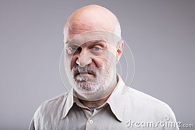 Old bald man disgusted and disappointed Stock Photo