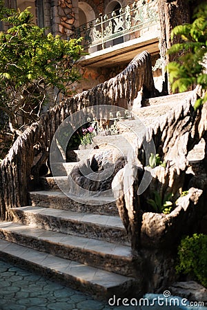 Old baroque stairs, outdoors. Stairs made of stone, small fountain with running water in the middle Stock Photo