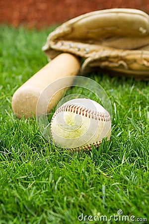 Old Base on Field with bat and glove Stock Photo