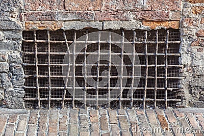 Old basement window with a lattice, covered with cardboard and boards Stock Photo