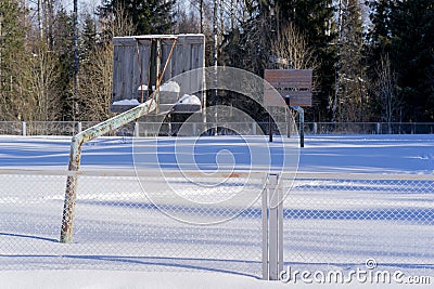 The old basketball court in the winter in the snow Stock Photo