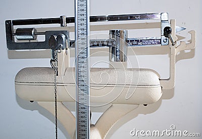 Old bathroom scale with measuring rod for the height and the weight Stock Photo